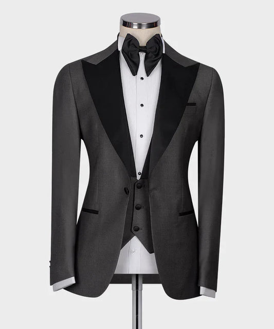 KOSS ATELIER Classic Dark Gray Tuxedo with black satin peak lapels matching vest and bow tie on mannequin