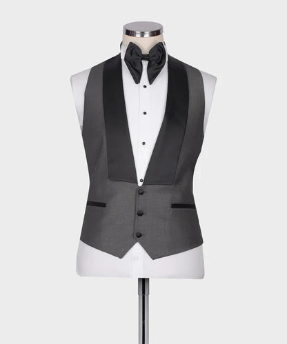 KOSS ATELIER Classic Dark Gray Tuxedo vest with black satin shawl lapel white dress shirt and black bow tie on mannequin
