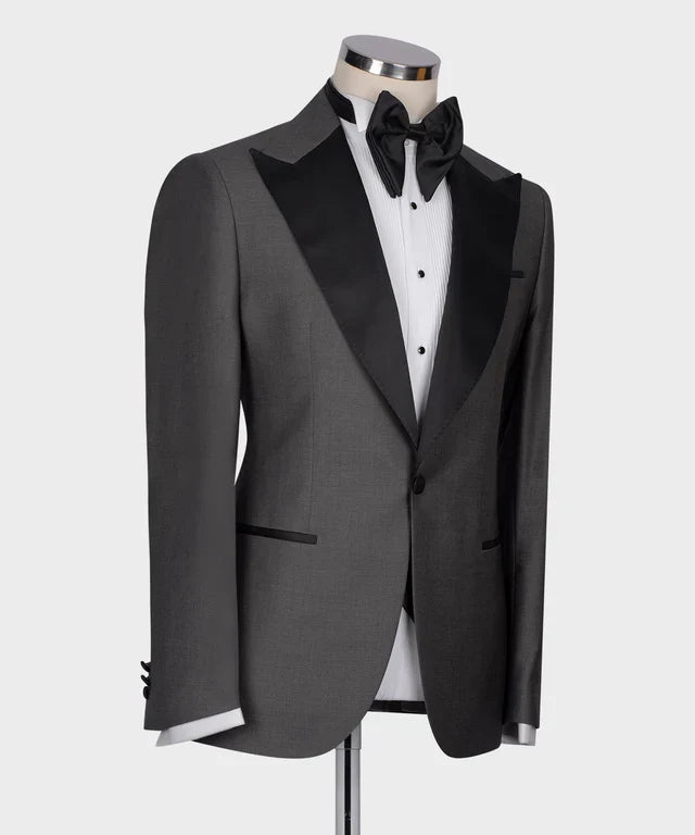 KOSS ATELIER Classic Dark Gray Tuxedo jacket with black satin peak lapel white dress shirt and black bow tie