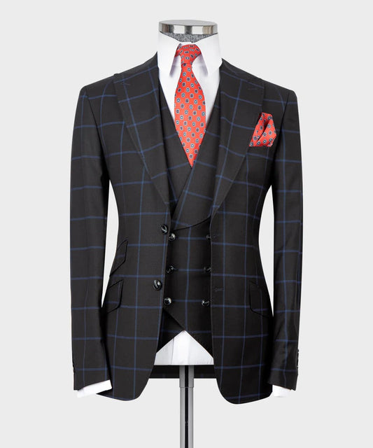 KOSS ATELIER tailored dark blue three piece suit with windowpane check waistcoat white shirt red tie