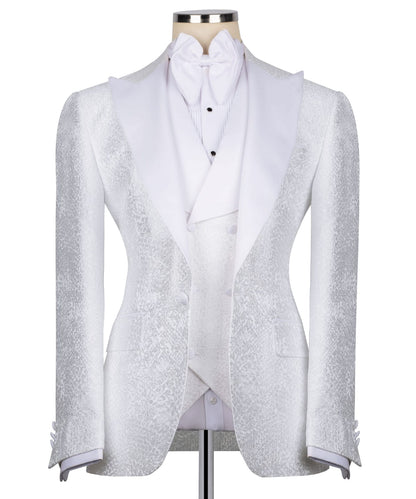 KOSS ATELIER white textured tuxedo for men on mannequin with shawl lapel vest and bow tie
