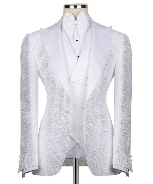 KOSS ATELIER white textured tuxedo for men on mannequin with shawl lapel vest and bow tie