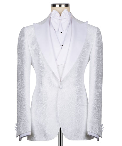 KOSS ATELIER white textured tuxedo for men single button jacket with shawl lapel matching vest and bow tie on mannequin