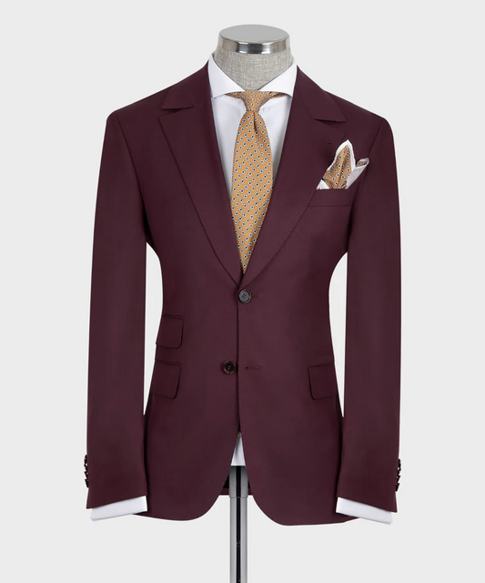 KOSS ATELIER tailored slim fit burgundy 3-piece suit for men on mannequin with white shirt gold patterned tie and pocket square