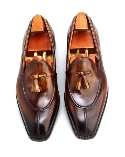 Premium brown loafer shoes with wooden shoe trees for enhanced shape and style