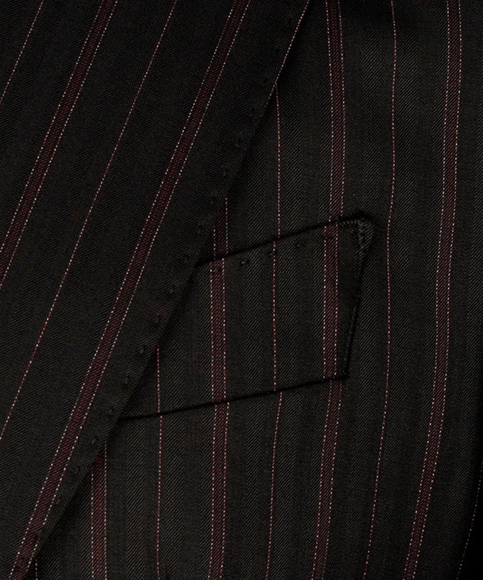 KOSS ATELIER black and red pinstripe suit close up of tailored lapel and chest pocket on wool fabric