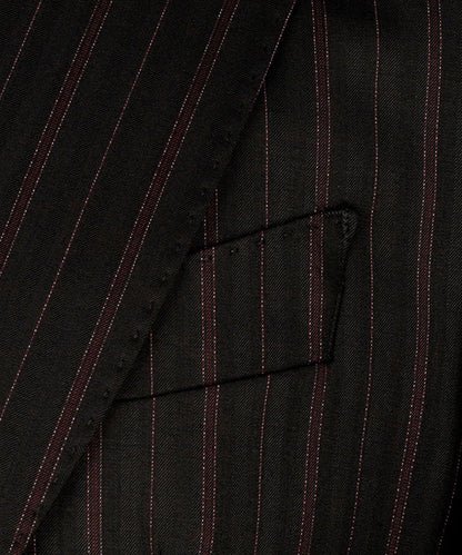 KOSS ATELIER black and red pinstripe suit close up of tailored lapel and chest pocket on wool fabric