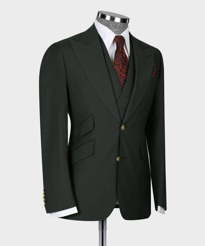 KOSS ATELIER deep green three piece suit on mannequin with tailored jacket waistcoat white shirt and red patterned tie