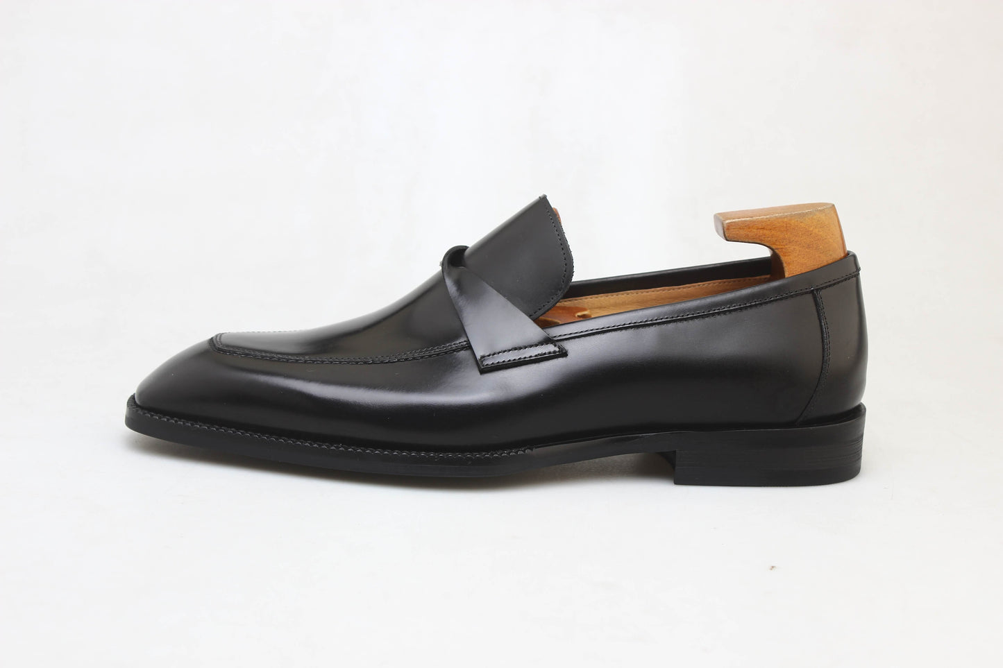 Sleek black apron loafers by KOSS ATELIER with a polished finish for stylish casual wear