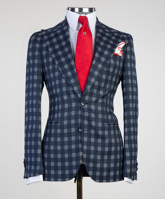 Stylish tailored plaid suit for men in navy and gray with a red tie and pocket square