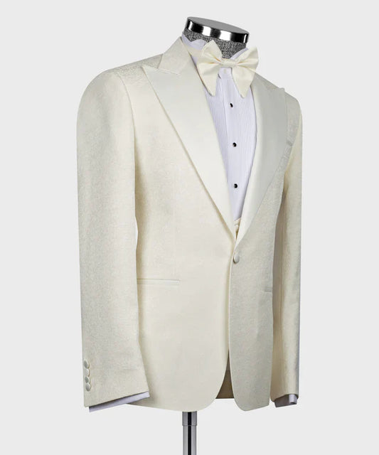 Ivory Velvet Tuxedo by KOSS ATELIER featuring a single button jacket with peak lapels and matching bow tie