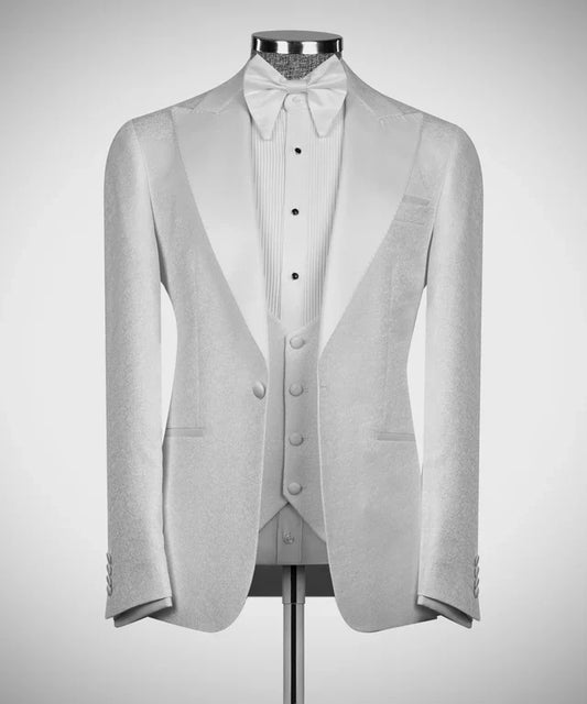 White Tuxedo with Satin Peak Lapels by KOSS ATELIER displayed on mannequin with matching vest and bow tie